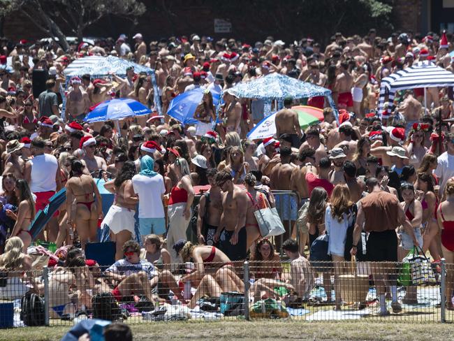 Makeshift fencing kept walkways open through the crowds. Picture: Daily Telegraph/ Monique Harmer