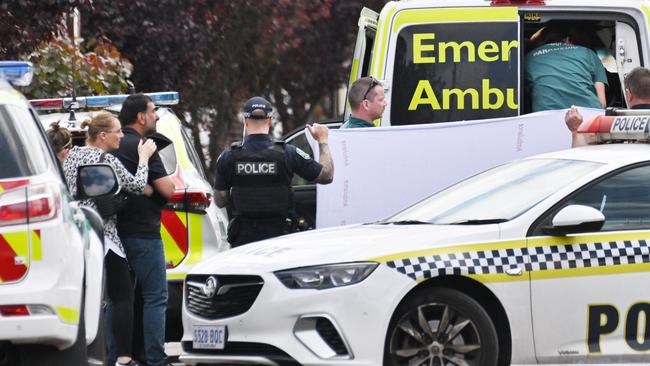 Family members at the scene in Jenkins Ave, Rostrevor, as the child is loaded into an ambulance. Picture: Brenton Edwards