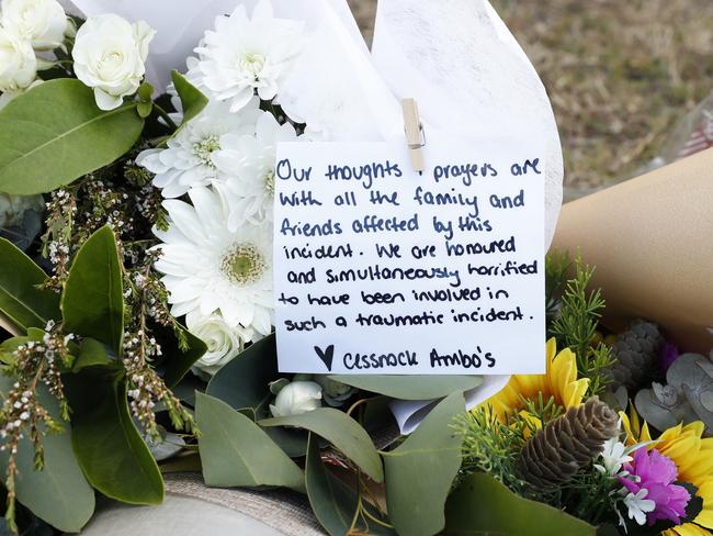 Floral tributes including one from the Cessnock Ambo’s left near the scene of the crash. Picture: Jonathan Ng