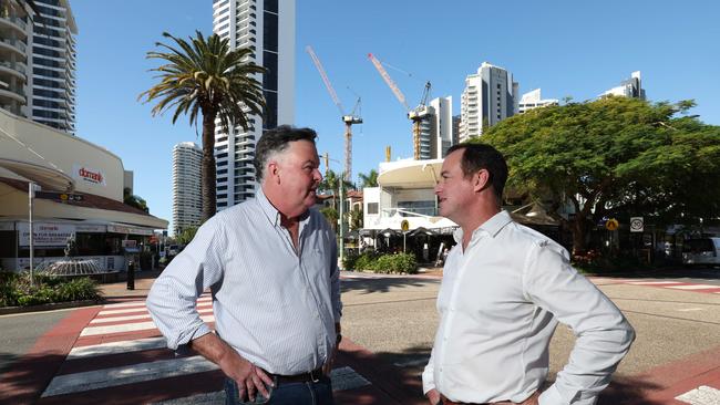 Scott Budgen from Shuck and Main Beach developer Jon Drew in Tedder Ave looking at the turnaround in Tedder, with business coming back in and towers rising in the area in a big way at Crane Beach. Picture Glenn Hampson