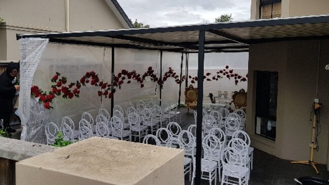 Wedding ceremony preparations in the family backyard. Picture: Steve Tyson