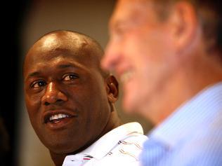 End of an era ... Wendell Sailor, flanked by coach Wayne Bennett, announces his retirement at St George Leagues Club. Photograph: Cameron Richardson