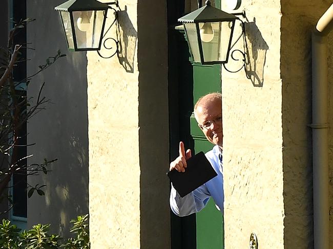 Australian Prime Minister Scott Morrison gestures to media at Kirribilli House in Sydney the morning after the election. Picture: AAP/Bianca Di Marchi