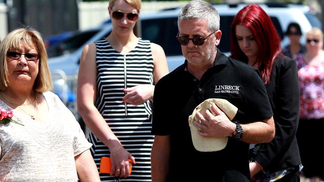 Residents stop for a minute’s silence.