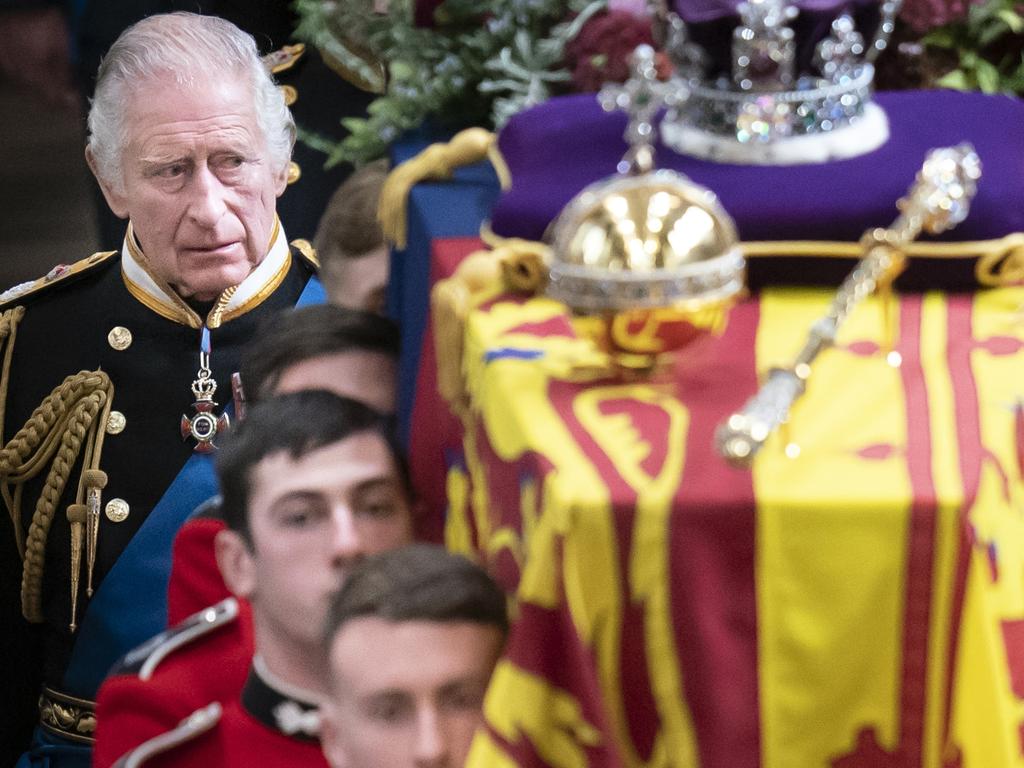 King Charles III follows behind the coffin of Queen Elizabeth II, draped in the Royal Standard with the Imperial State Crown and the Sovereign's orb and sceptre. Picture: Getty Images