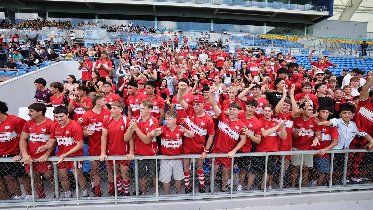 NRL National Schoolboys Cup final at CBUS Stadium between Palm Beach Currumbin and Patrician Blacktown Brothers. The Red Army and Palm Beach Currumbin players celebrate the win. .Picture Glenn Hampson