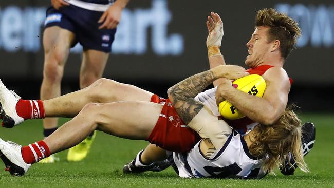 Swans midfielder Luke Parker is tackled by Geelong’s Tom Stewart. Picture: Michael Klein