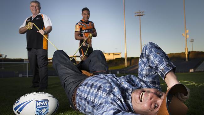 <s1>Campbelltown Mayor Paul Lake and Wests Tigers centre Tim Simona are ready to rope a<s1/>“cowboy”, Macquarie Fields resident John Durban, ahead of Saturday‘s game at Campbelltown Stadium. Picture: Melvyn Knipe </s1>