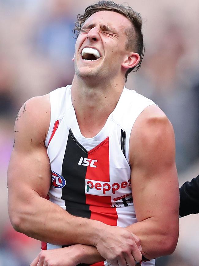 Luke Dunstan in agony after hurting his shoulder.