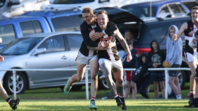 Millicent's Gene Robinson celebrates after kicking his 1000th career goal. Picture: Thomas Miles