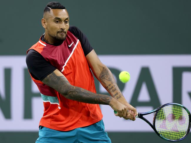 INDIAN WELLS, CALIFORNIA - MARCH 14: Nick Kyrgios of Australia returns a shot to Casper Ruud of Norway of during the BNP Paribas Open at the Indian Wells Tennis Garden on March 14, 2022 in Indian Wells, California. (Photo by Matthew Stockman/Getty Images)