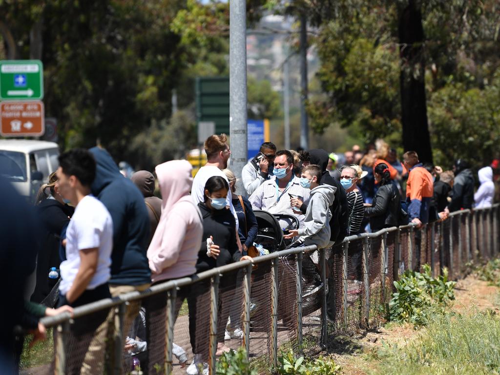 People are seen queuing at a COVID testing facility at Parafield Gardens in Adelaide. Picture: NCA NewsWire / David Mariuz