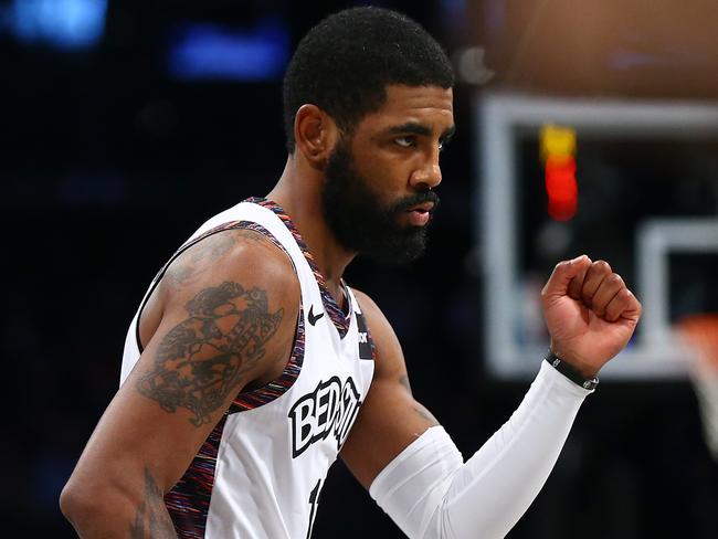 NEW YORK, NEW YORK - JANUARY 12:  Kyrie Irving #11 of the Brooklyn Nets pumps his fist against the against the Atlanta Hawks at Barclays Center on January 12, 2020 in New York City. Brooklyn Nets defeated the Atlanta Hawks 108-86.NOTE TO USER: User expressly acknowledges and agrees that, by downloading and or using this photograph, User is consenting to the terms and conditions of the Getty Images License Agreement.   (Photo by Mike Stobe/Getty Images)