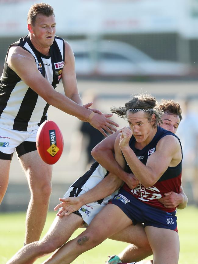 Sandhurst’s Seb Collins is brought to ground in a tackle.