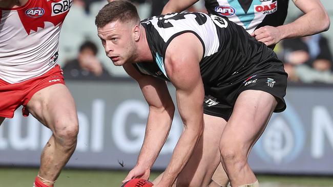 Port Adelaide ruckman Peter Ladhams looks to handball. Picture: SARAH REED