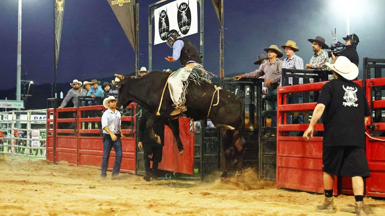 Jake McManus competes in the novice bull ride at the 2024 Cairns Bull Throttle event, a bikes and bulls show, featuring bull riding and freestyle motocross riders at the Cairns Showgrounds. Picture: Brendan Radke