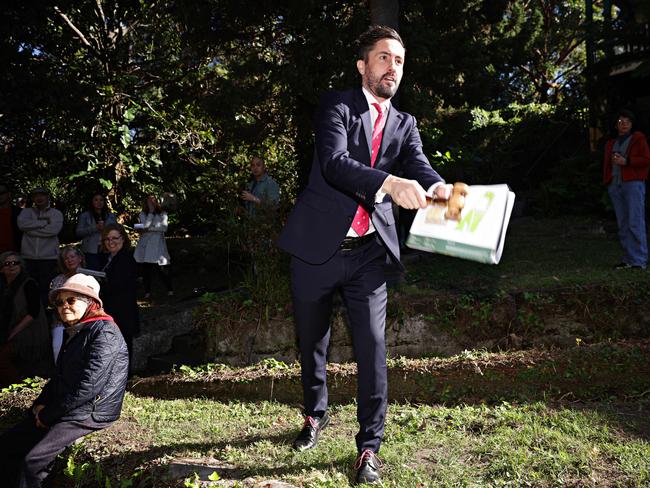 Auction clearance rates remain strong across Sydney with auctioneer Andrew Robinson dropping the hammer on a Woolwich knockdown-rebuild for $5.6m. Picture: Adam Yip