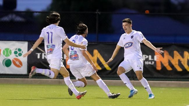 Adelaide Comets player Ninko Beric celebrates scoring against Adelaide Olympic during their SA Premier League soccer match at the Parks in February. Picture: Adam Butler