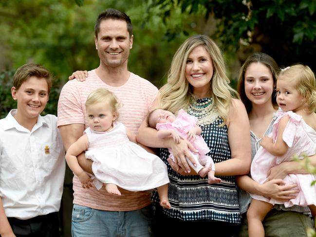 1/3/16 - Gavin Wanganeen's wife Pippa gave birth to their third child together, baby girl Posey, 1.5 weeks ago. Gavin and Pippa are pictured at their Beaumont home with their daughters Kitty, 2, Lulu, 14 months and newborn Posey and Gavin's children Tex, 12 and Mia, 15 from a previous marriage. Photo Naomi Jellicoe