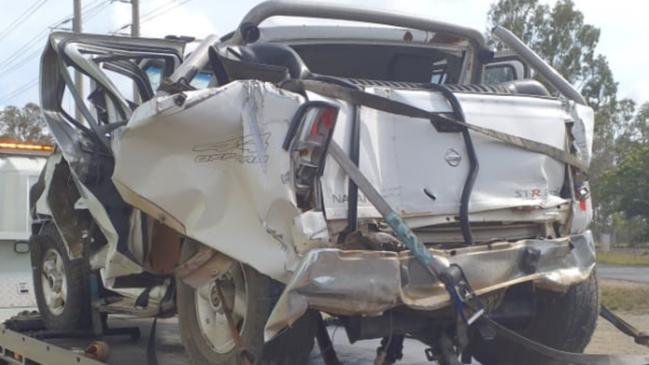 Police allege the Nissan Navara was hit from behind by a prime mover on the Bruce Highway at Raglan. A mother and teenage boy were killed.