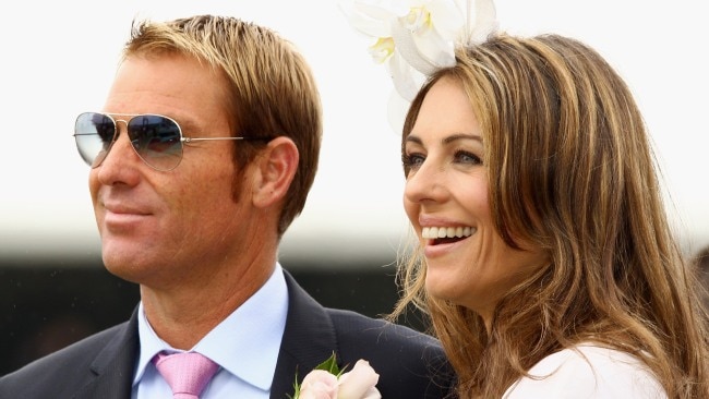 Shane Warne and Elizabeth Hurley are seen at Crown Oaks Day at Flemington Racecourse on November 3, 2011. Picture: Mark Dadswell/Getty Images