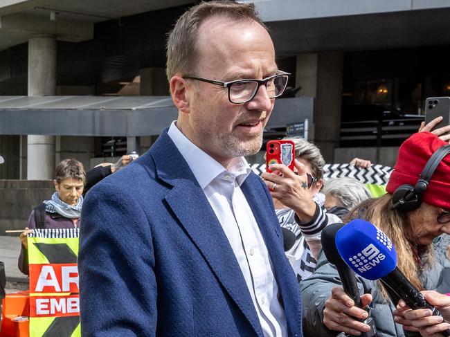 Anti-war activists attempt to disrupt the Land Forces 2024 International Land Defence Exposition at the Melbourne Convention and Exhibition Centre. Greens Senator David Shoebridge visits protesters before speaking to the media. Picture: Jake Nowakowski