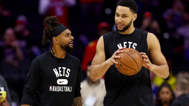 Ben Simmons with Nets teammate Patty Mills.