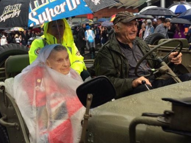 Veteran war nurse Anne Leach, 101, braves the rain as she takes part in the annual Anzac Day parade and march through Perth. Picture: Danielle Le Messurier