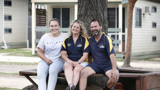 Beachcomber Caravan Park owners Debbie and Paul Preston, with daughter Demi, are back taking bookings for their Mallacoota sites and cabins.