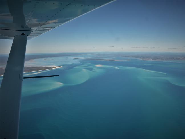 The Great Sandy Strait from a light plane. Protected zones in the Great Sandy Marine Park will increase by 9 per cent in 2024 in an effort to boost biodiversity and tourism opportunities.