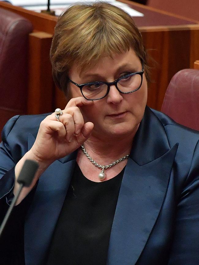 Senator Linda Reynolds wipes a tear during Question Time in the Senate on February 18.