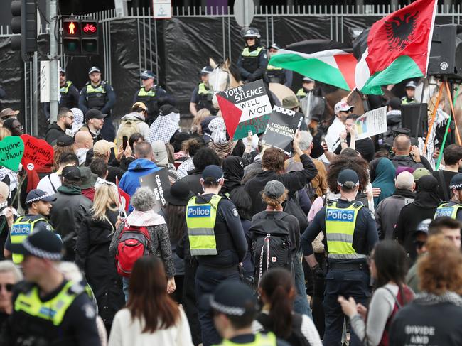 Police hold a line in front of pro Palestine protesters at the Exhibition building ahead of Land Forces the 2024 International Land Defence Exposition to be held in Melbourne. Sunday, September 8. 2024. Picture: David Crosling