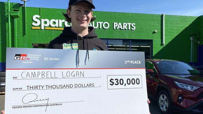 Tasmanian motor ace Campbell Logan with his prize for claiming second over in the 2023 Australian Toyota 86 championship. Picture James Bresnehan