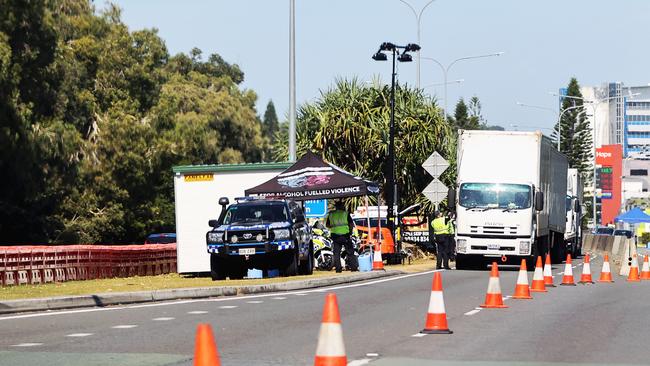 Police checking trucks at the Queensland border on the Gold Coast Hwy, Coolangatta. Picture: NIGEL HALLETT