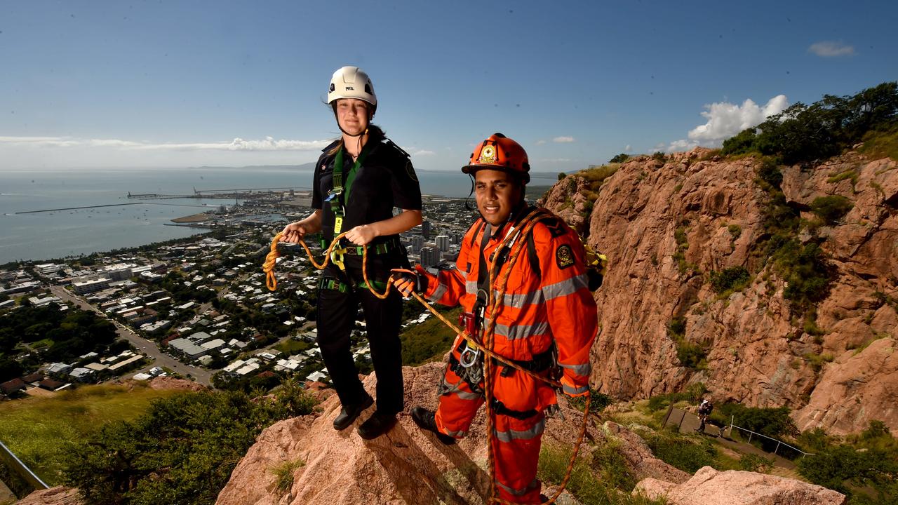 Carly Hall and Ethan Bressan from the Townsville SES abseil off Castle Hill. The suburb of the same name has glorious views. Picture: Evan Morgan