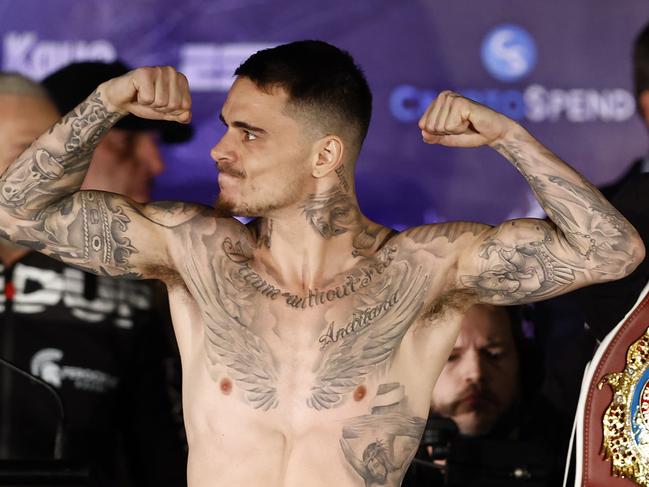 George Kambosos Jr flexes after making weight. Picture: Darrian Traynor/Getty Images