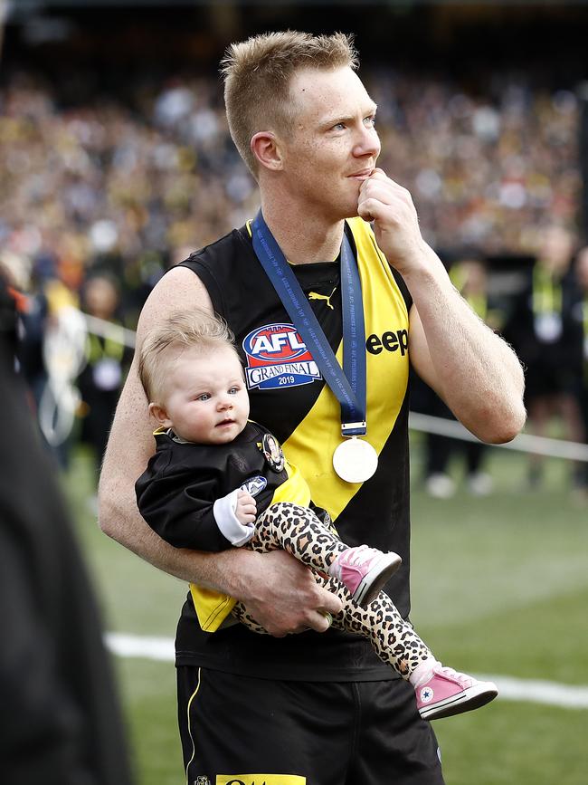 Jack Riewoldt celebrates this year’s premiership with his daughter Poppy. Picture: GETTY