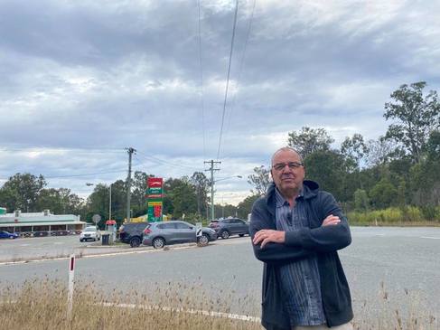 Carl Stevens on the corner of David Drive and Bruce Highway, Curra