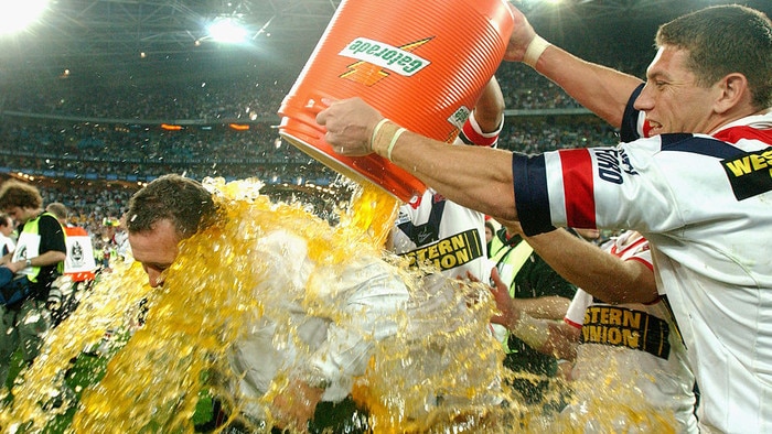 SYDNEY - OCTOBER 6: Ricky Stuart, coach of the Roosters is drenched in Gatorade by Bryan Fletcher #11 during the 2002 NRL Grand Final played between the Sydney Roosters and the New Zealand Warriors held at Telstra Stadium in Sydney, Australia on October 6, 2002. The Roosters defeated the Warriors 30-8. (Photo by Nick Laham/Getty Images)