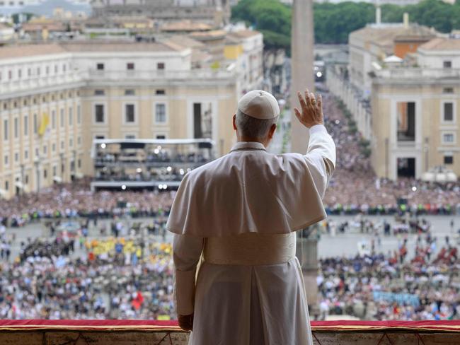TOPSHOT - This photo taken and handout on May 11, 2025 by The Vatican Media shows Pope Leo XIV during his first Reginal Caeli prayer from the main central loggia of St Peter's basilica in The Vatican. (Photo by Handout / VATICAN MEDIA / AFP) / RESTRICTED TO EDITORIAL USE - MANDATORY CREDIT 