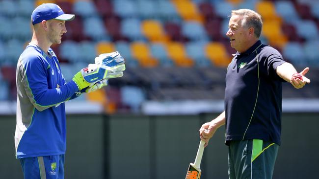Peter Nevill and Ian Healy during the Australian Cricket team training at the Gabba. Pic Darren England.