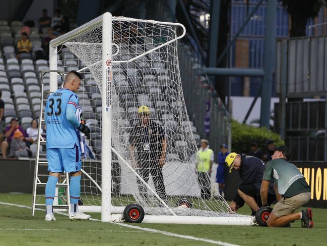 Play was on hold in the first half of play as workers set up a replacement goal to replace a damaged goal post during the Round 10 A-League match between the Central Coast Mariners and the Perth Glory at Central Coast Stadium in Gosford, Monday, December  31, 2018. (AAP Image/Darren Pateman) NO ARCHIVING, EDITORIAL USE ONLY