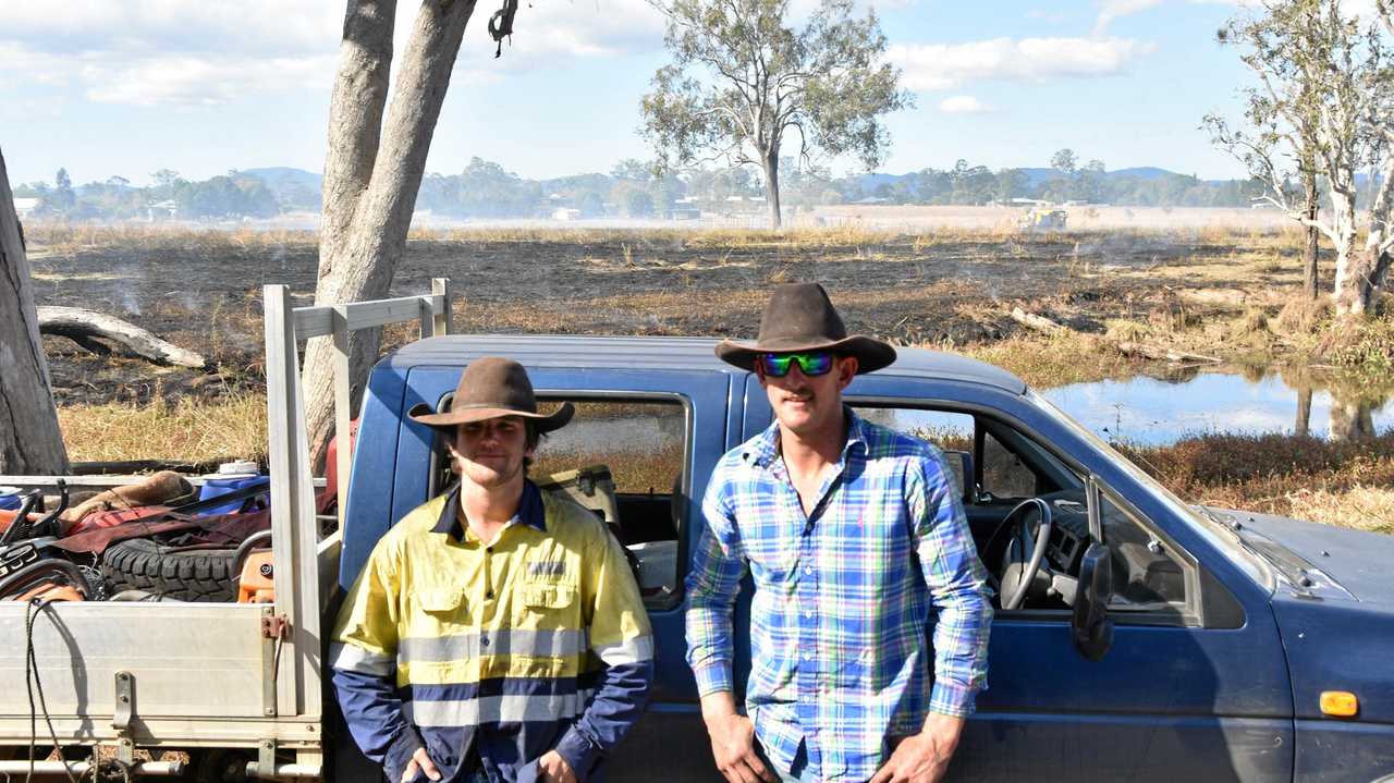 ON THE SCENE: Fencing contractors Corey Neill and Jed Farraday helped put out a grass fire at Bororen yesterday. Picture: Greg Bray