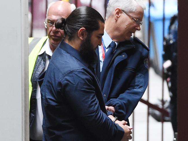 Murat Kaya, accused of playing an instrumental role in the "tinnie terror" plot, arrives at the Supreme Court in Melbourne, Thursday. Nov. 24, 2016. Plumpton father Murat Kaya, 25, is seeking to be bailed on the charge of making preparations for incursions into a foreign county, initially named by police as Syria and which his barrister Michael Tovey QC says can no longer be made out. (AAP Image/Tracey Nearmy) NO ARCHIVING