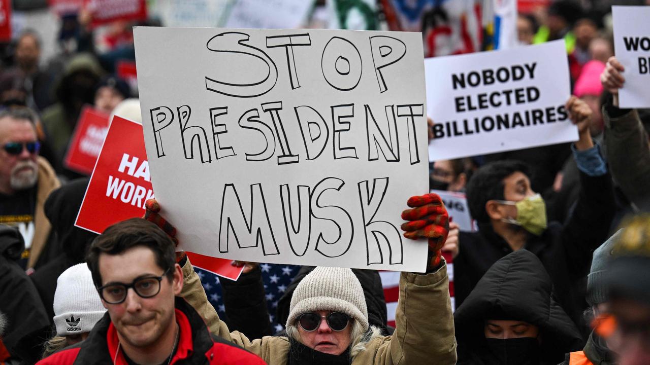 People protesting against President Trump’s appointment of Elon Musk to the Department of Government Efficiency and the power Musk is wielding. Picture: Drew Angerer / AFP