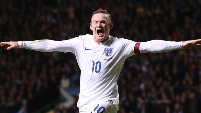 Wayne Rooney celebrates scoring England’s third goal.