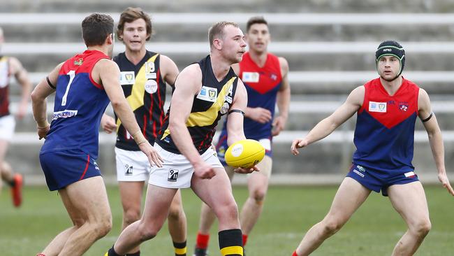 Marcus Gardner of Tigers handballs in a TSL North Hobart Demons v Tigers at North Hobart Oval. Picture: MATT THOMPSON