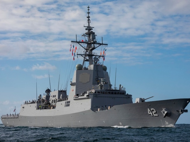 Air Warfare Destroyer NUSHIP Sydney sails through Sydney Heads and enters her namesake harbour for the first time on 27 March 2020. *** Local Caption *** NUSHIP Sydney arrived in her namesake city for the first time on 27 March 2020, 36 years to the day since the last warship to carry the name arrived in Sydney. The 147-metre long Air Warfare Destroyer came alongside her new homeport at Garden Island in Sydney following the transit from Osborne in South Australia where she was built. Sydney is the last of three Hobart Class vessels built for the Royal Australian Navy and is based on the Navantia F100 frigate design. She is equipped with advanced combat systems, providing the ship with the layered defensive and offensive capabilities required to counter conventional asymmetrical threats. Sydney will commission into the Royal Australian Navy in May 2020. Her sister ships Hobart and Brisbane commissioned in 2017 and 2018 respectively.