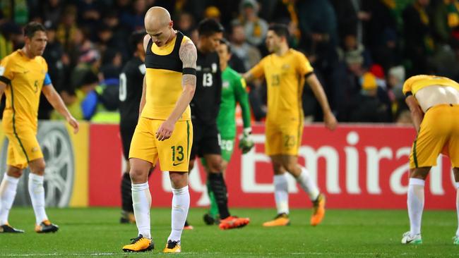 Aaron Mooy of the Socceroos and his teammates react as they leave the field at full time after the 2018 FIFA World Cup Qualifier match between the Australian Socceroos and Thailand.