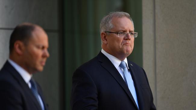 Prime Minister Scott Morrison (right) and Treasurer Josh Frydenberg speak during a press conference at Parliament House federal stimulus Picture: Sam Mooy/Getty